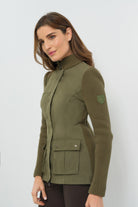 Side view of olive green jacket featuring front pockets and knitted sleeves.