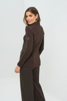 Front view of olive green jacket featuring  knitted back and side.