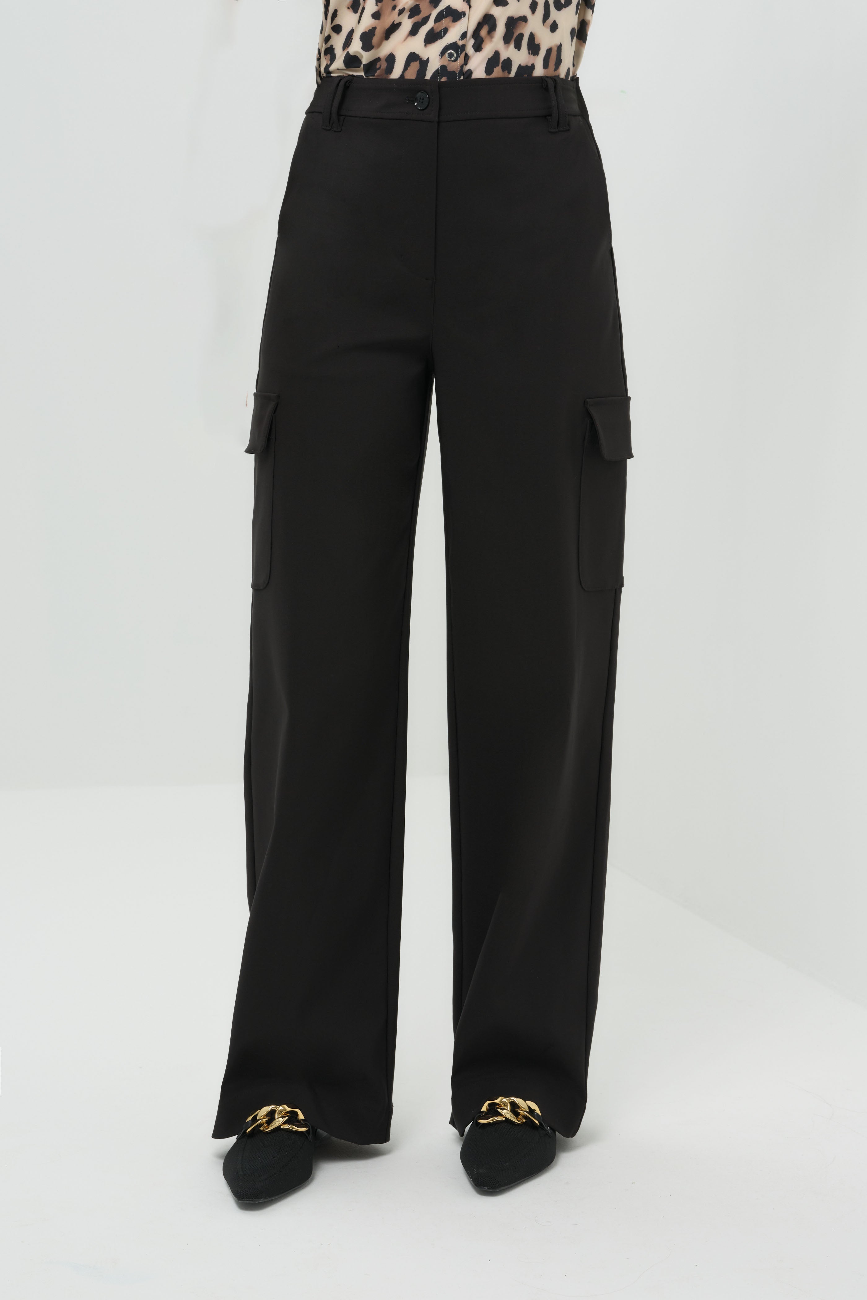 A front-facing look at the wide-leg pants, showcasing their flowing silhouette and relaxed fit and pocket detail.