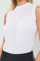 Detailed shot featuring delicate pointelle detailing across the upper chest and a vertical textured stripe down the center front.