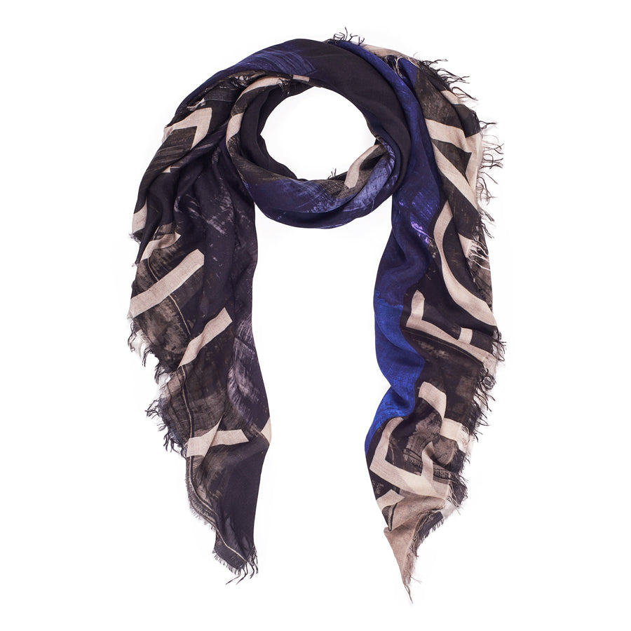 The SUZI ROHER Elegantly scarf is a 145 x 145 cm modal silk accessory featuring frayed edges and an abstract black, beige, and blue pattern on white—perfect for adding distinctive flair to any outfit.