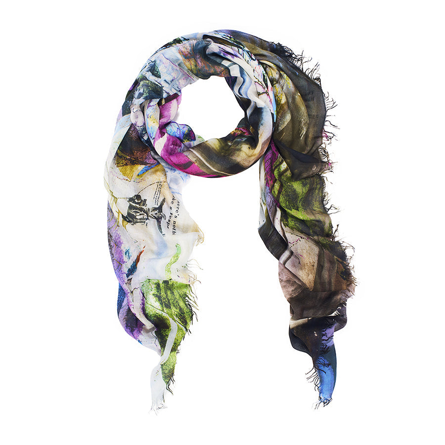 The SUZI ROHER "Nothing Like A Vespa" is a lightweight, rectangular Modal Silk scarf with frayed edges, showcasing a colorful abstract pattern in blue, green, purple, and brown on a white background. Made in Italy.