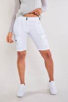 The Best Travel Shorts. Woman Showing the Front Profile of an Apiedi Shorts in White.
