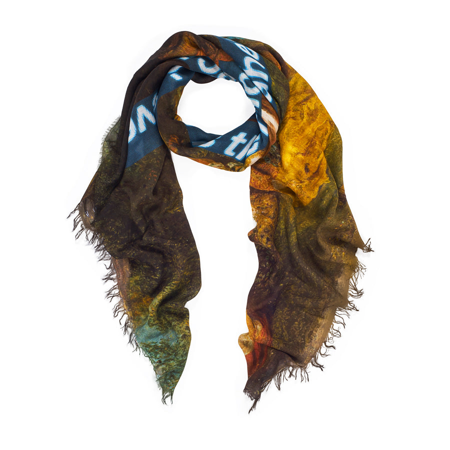 The "Time for the Future" modal silk scarf by SUZI ROHER features frayed edges and an abstract forest-inspired design in yellow, brown, and green with bold blue and white digital-style text across the lightweight fabric.