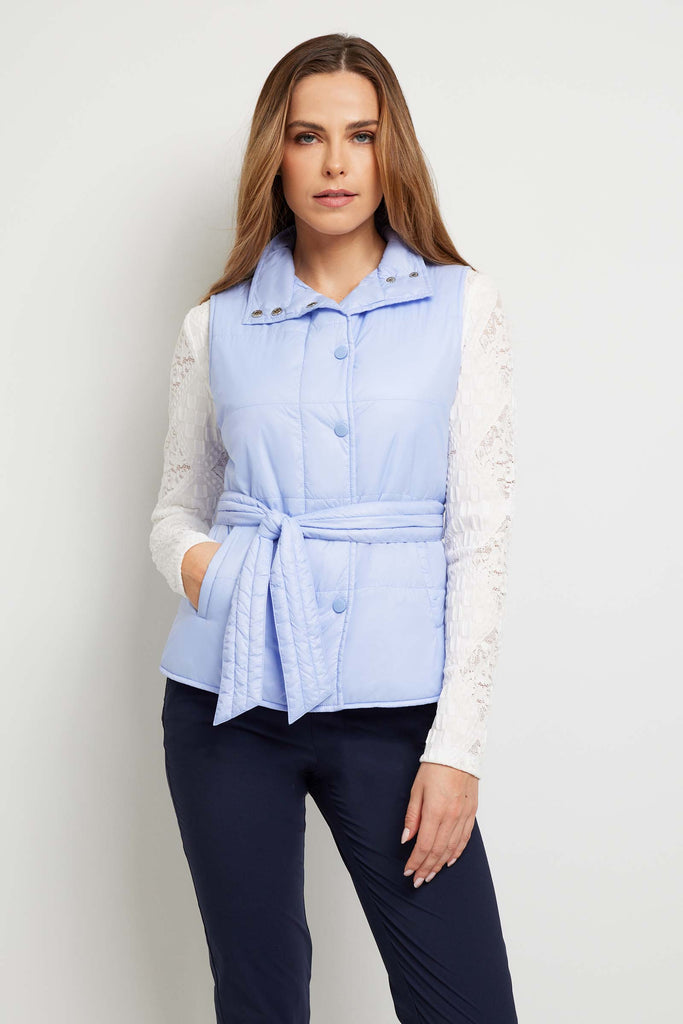 The Best Travel Vest. Woman Showing the Front Profile with the Collar Down of an Ainslee Quilted Vest in Periwinkle