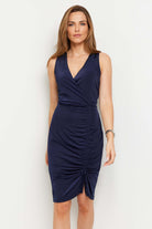 The Best Travel Dress. Woman Showing the Front Profile of an Avana Dress in Navy.