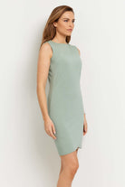 The Best Travel Dress. Woman Showing the Side Profile of a Johanna Dress in Sage.