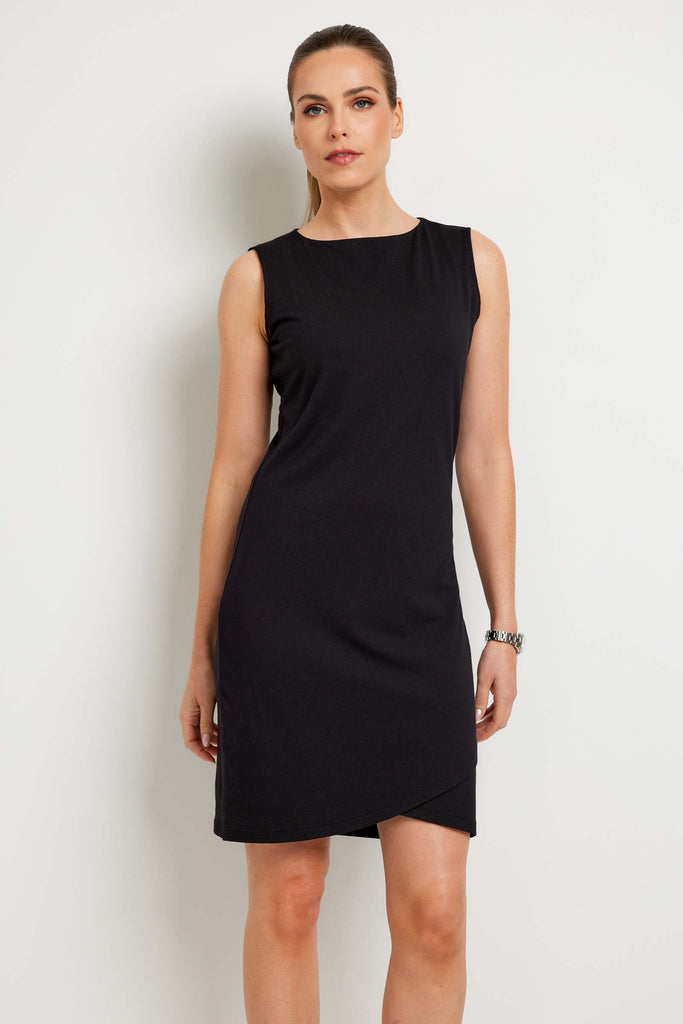 The Best Travel Dress. Woman Showing the Front Profile of a Johanna Dress in Black.