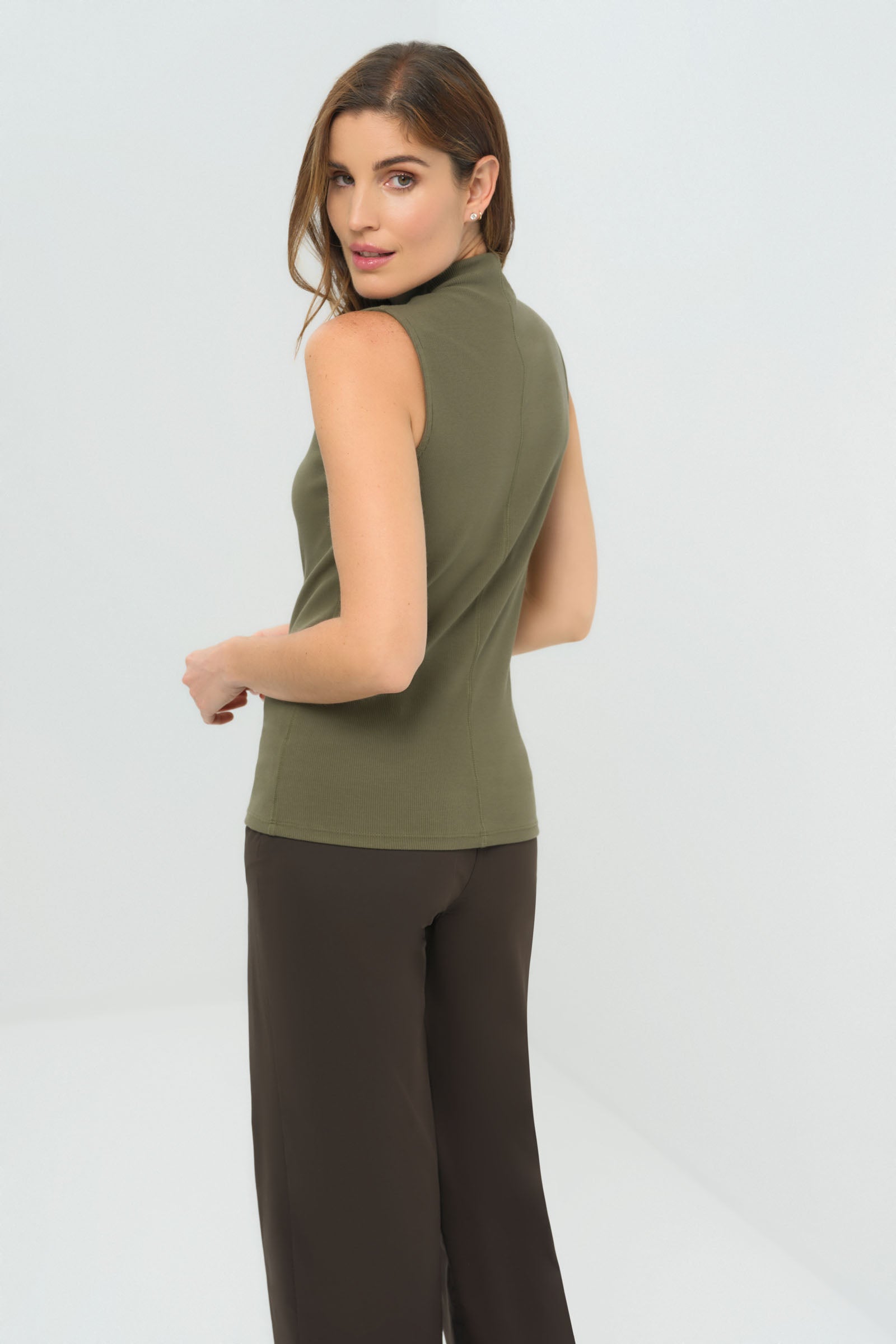 Side view of olive short sleeveless mock neck top