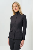 Black button-up jacket fastened to the neck, paired with slim black pants for a sharp, streamlined silhouette.