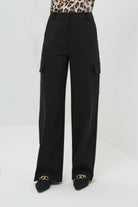 A front-facing look at the wide-leg pants, showcasing their flowing silhouette and relaxed fit and pocket detail.