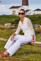 The Best Travel Jacket. Lifestyle Image of a Bailey Camo Mesh Jacket in White.