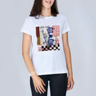 A woman wearing The Niki white t-shirt by SUZI ROHER, featuring a colorful abstract graphic and "ONLY MAYBE" text inspired by My Way, stands against a plain light gray background.