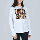 A smiling woman with medium-length brown hair wears The Catherine, a white long-sleeve shirt by SUZI ROHER featuring a colorful, abstract modern graphic, standing against a plain light gray background.