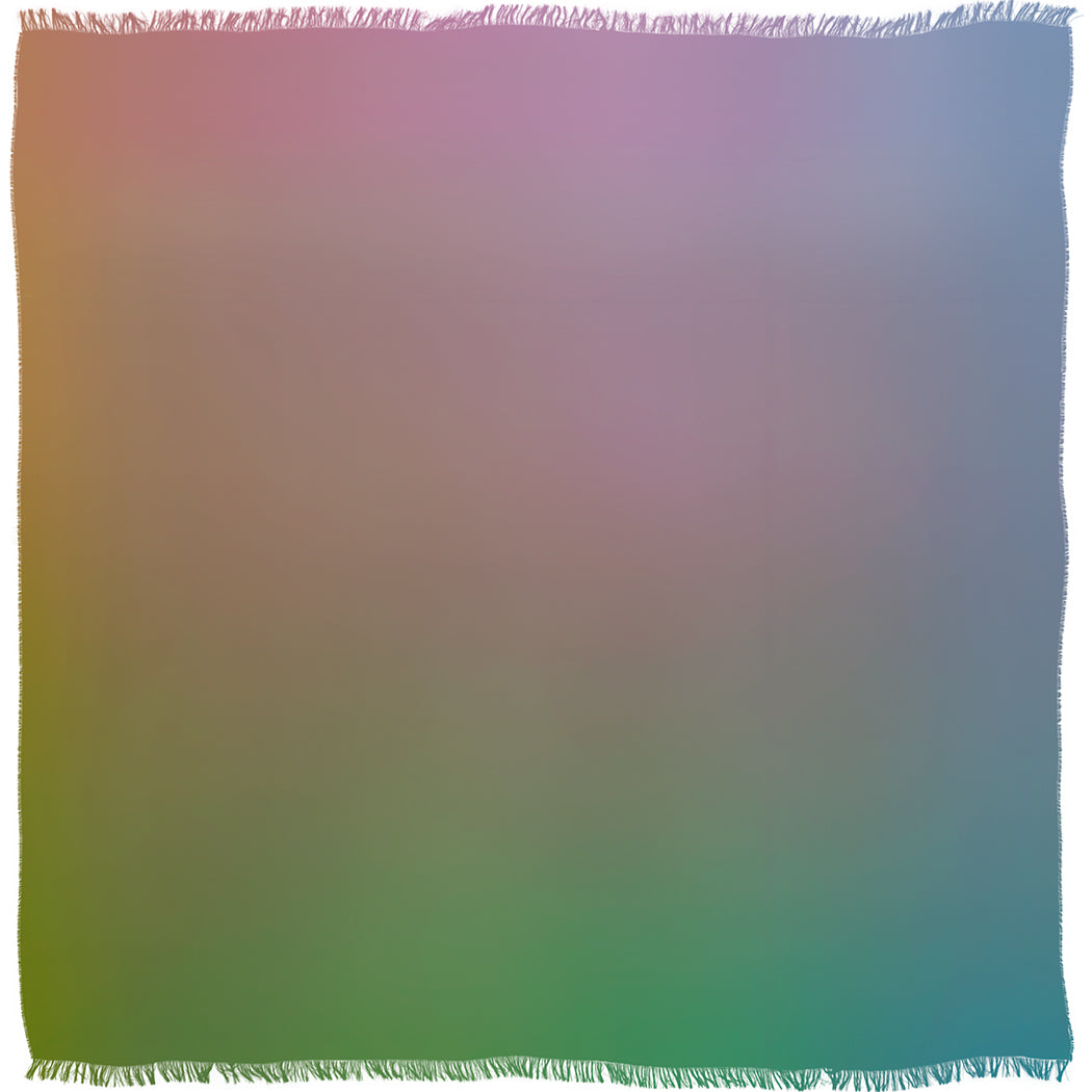 The SUZI ROHER Morning Has Broken v.02 woven blanket, made in Italy, features fringed edges and a soft gradient of pastel pink, lavender, green, and blue blending like a shifting cloud.