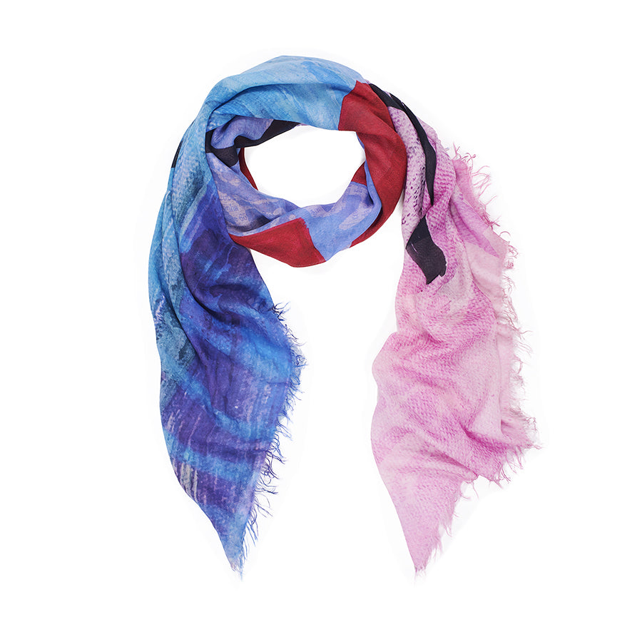 The SUZI ROHER "I Love U" scarf is a lightweight modal silk accessory with frayed edges and an abstract blue, purple, red, and pink pattern, shown in a loose loop on a white background.