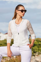 The Best Travel Jacket. Lifestyle Image of a Bailey Camo Mesh Jacket in White.