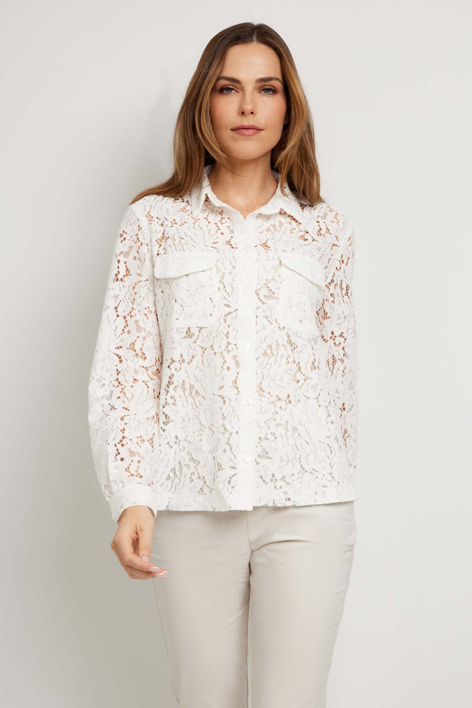 The Best Travel Top. Woman Showing the Front Profile of an Estella Stretch Lace Button Up Top in Off White.