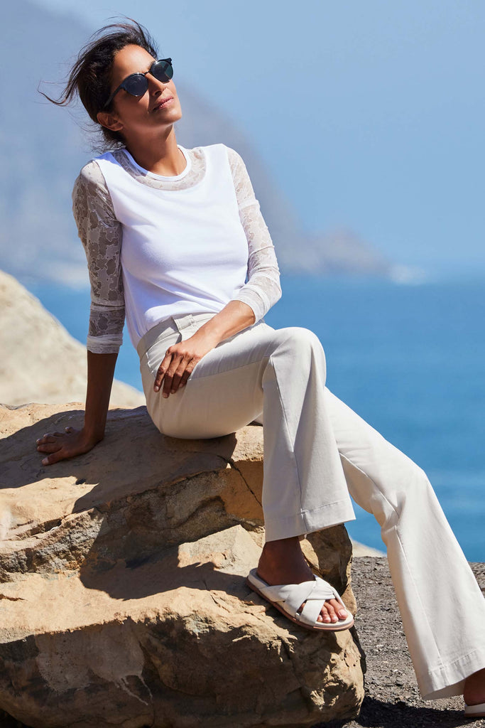 The Best Travel Pant. Lifestyle Image of a Darby Pant in Stone.