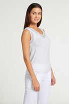The Best Travel Tank Top. Woman Showing the Side Profile of a Jackson Pima Tank in White.
