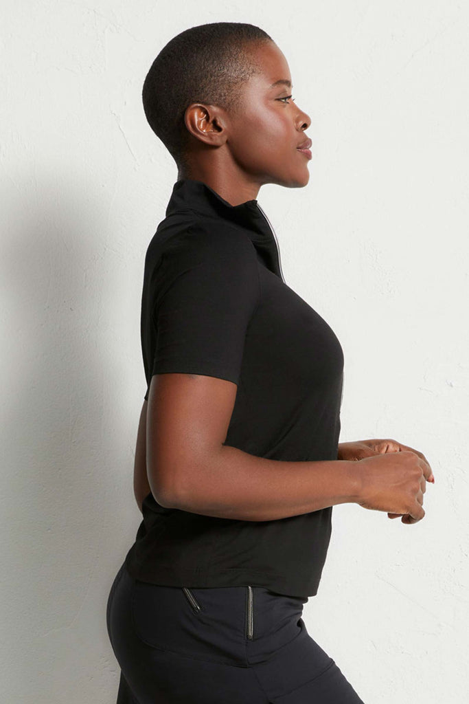 The Best Travel Top. Woman Showing the Side Profile of a Serena Top in Black ||