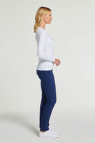 The Best Travel Top. Woman Showing the Side Profile of a Tony Pima Cotton Long-Sleeve Top in White